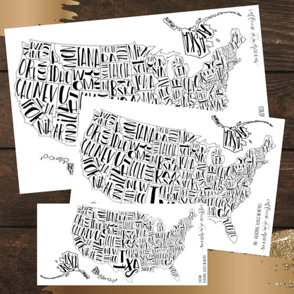 Three sheets of stickers featuring die cut black and white maps of the United States on a wooden surface